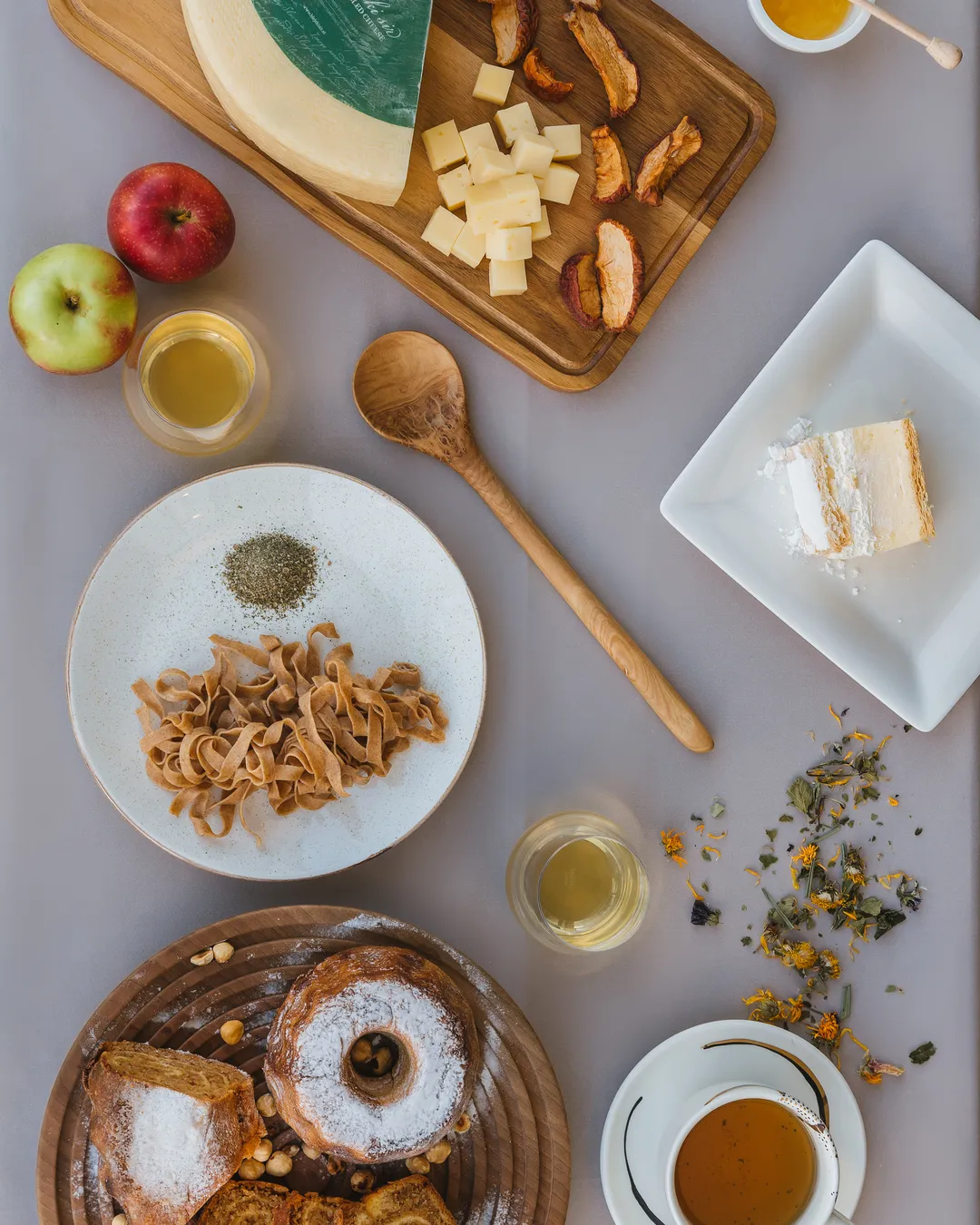 A plated seasonal dish seen from above, with wine and linen